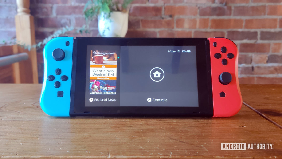Examen du contrôleur Kinvoca Joypad pour Nintendo Switch attaché au commutateur
